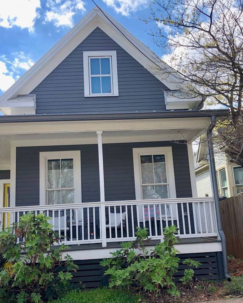 A gray house with a front porch in Cabbagetown, Atlanta