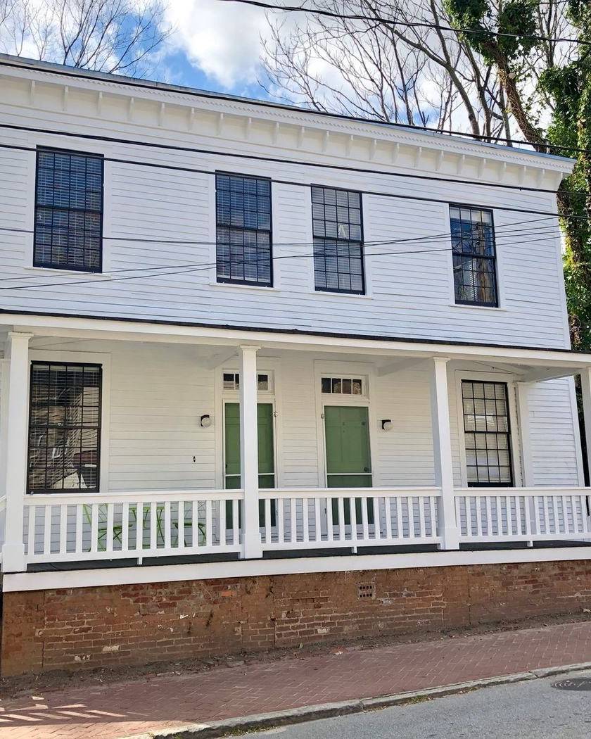A white two-story house in Cabbagetown, Atlanta
