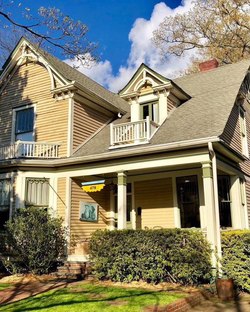 A gabled house with a wraparound porch in Grant Park, Atlanta