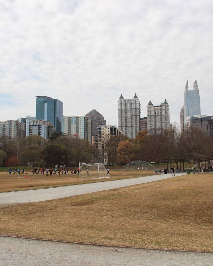Atlanta skyline beyond the meadow in Piedmont Park