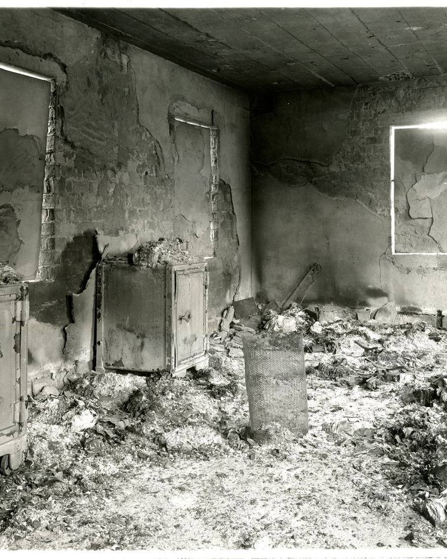 A room burned out by fire, its walls charred and contents reduced to ash