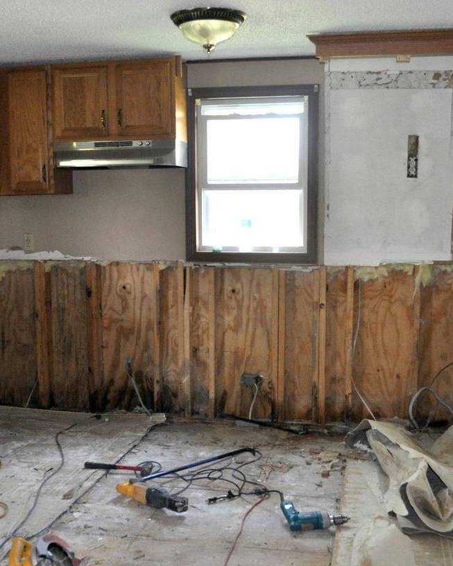 A kitchen stripped to the studs after flood damage
