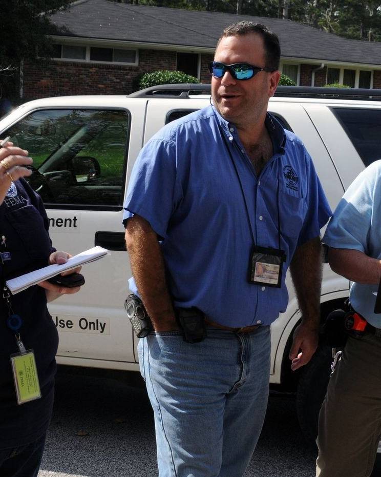 Damage inspectors with clipboards at a home in DeKalb County, Georgia