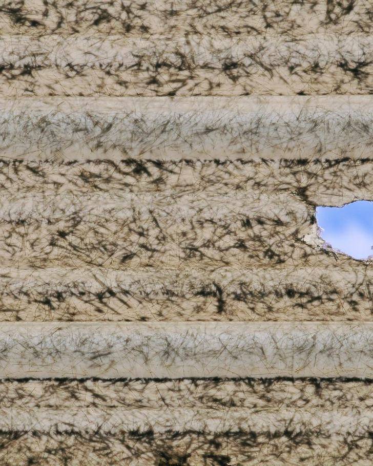 A hole punched through a fiberglass skylight by a hailstone