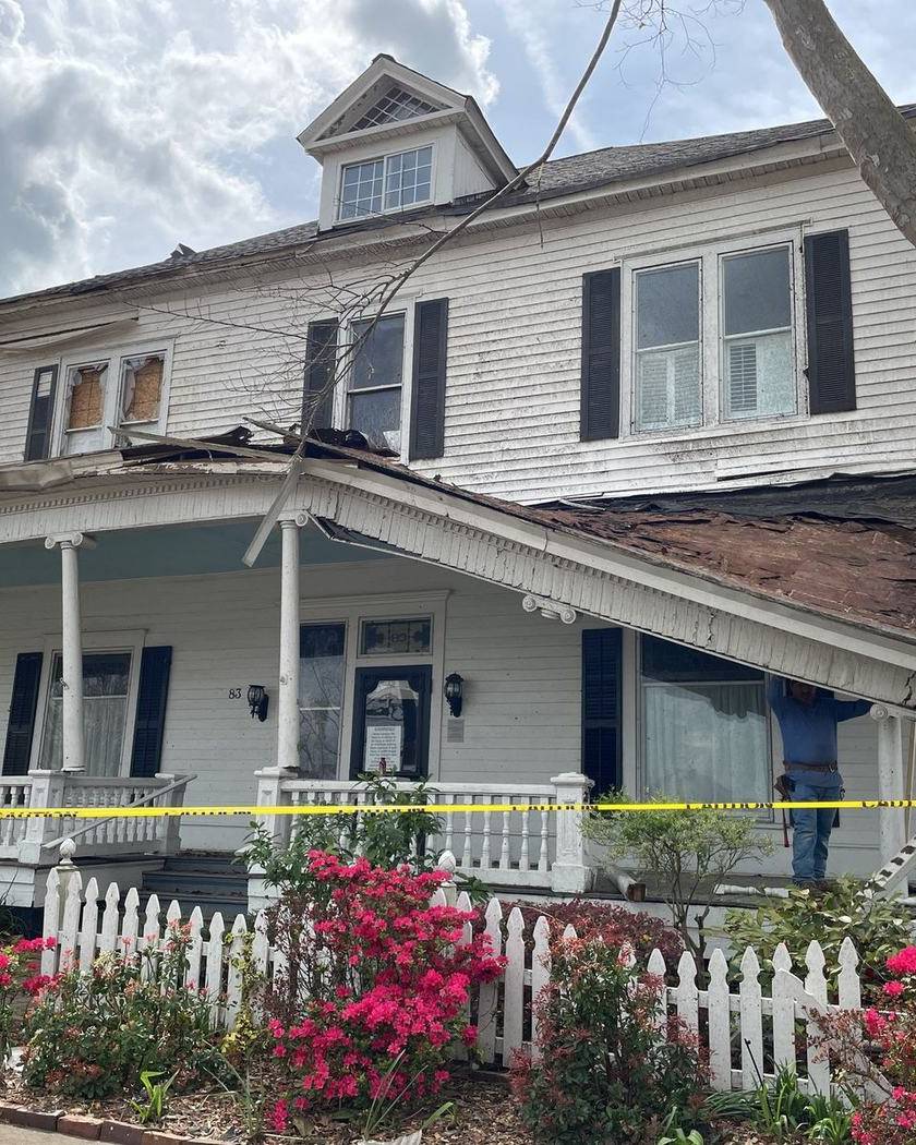 A storm-damaged house taped off in Newnan, Georgia